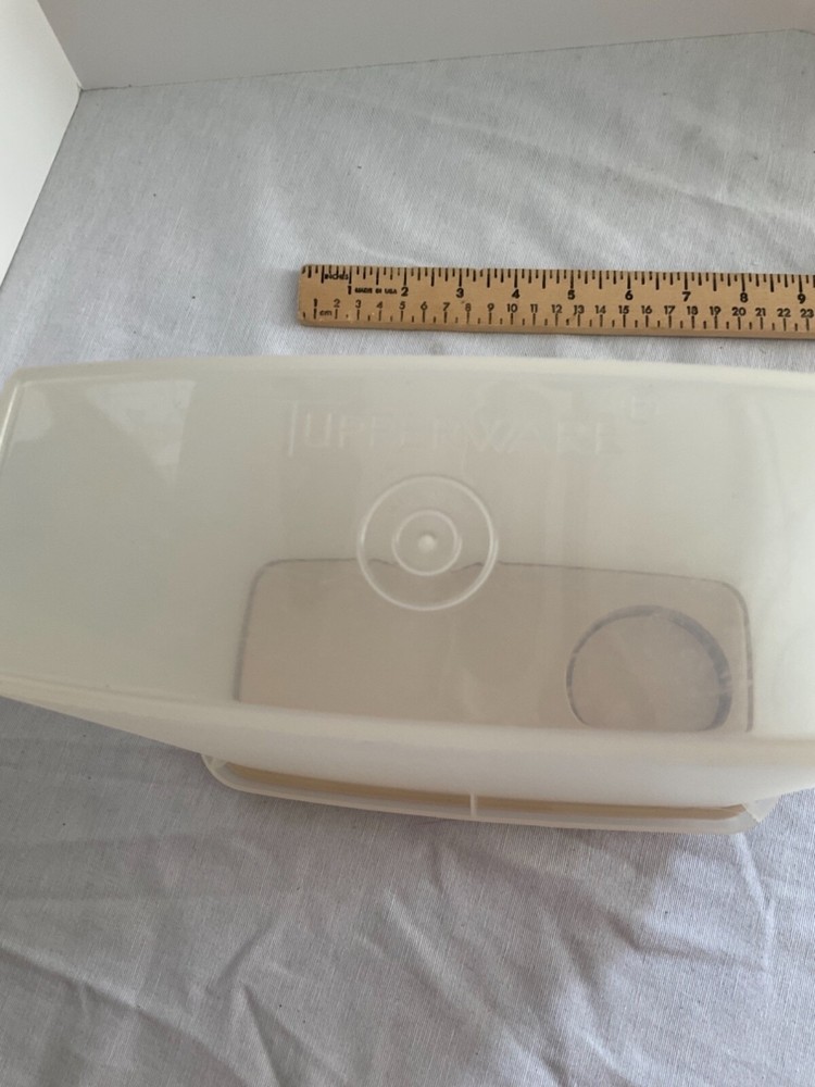 Tupperware container with beige pour lid 8” x7”
