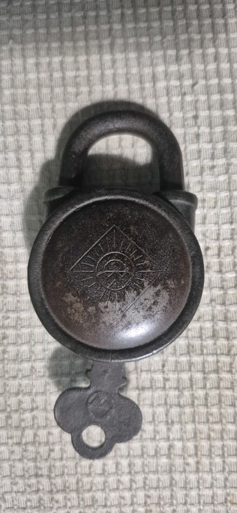 Vintage lock and key with design on the front