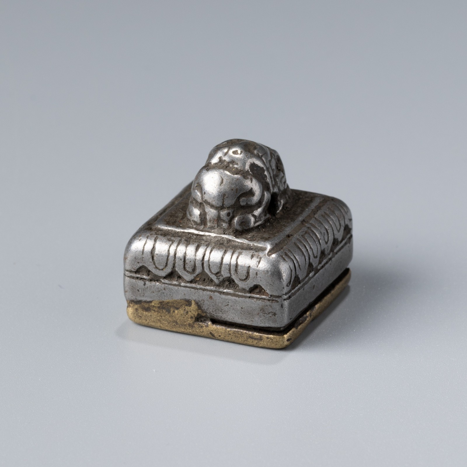 Tibetan Bronze and Iron Seal with Conch Motif