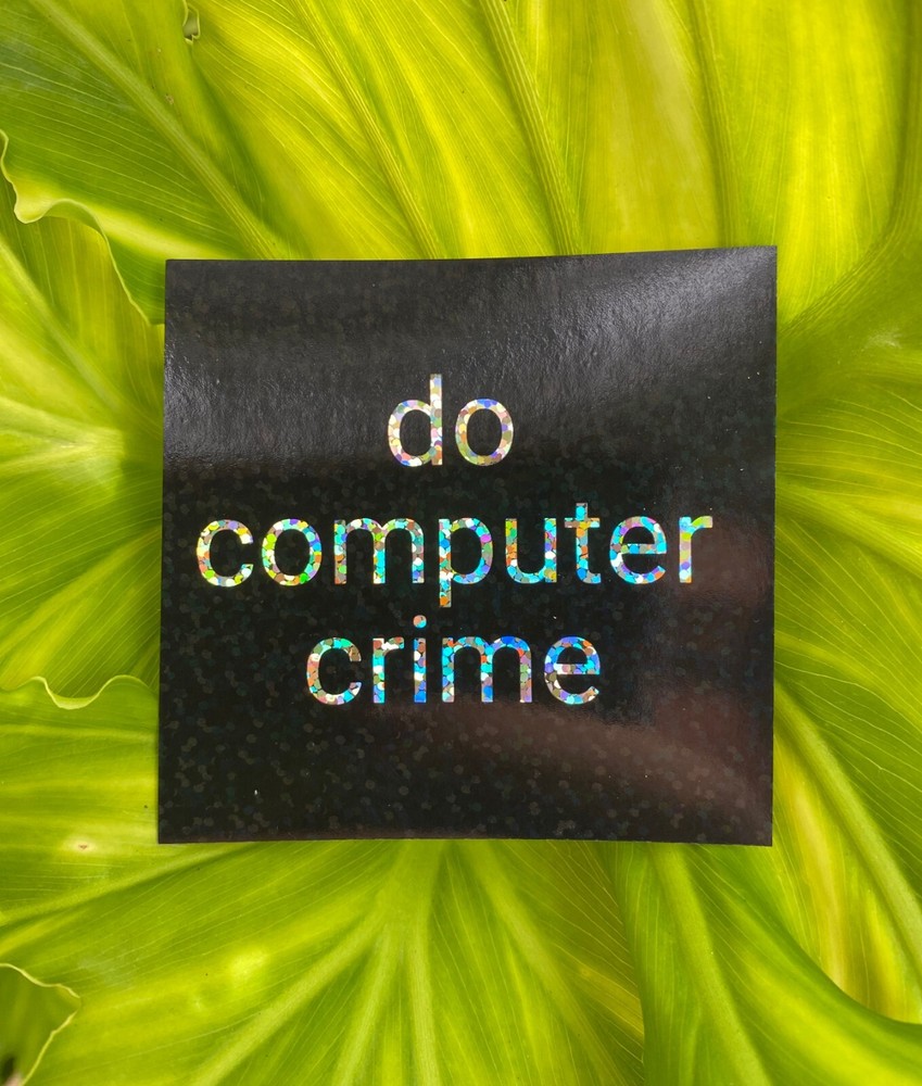Glitter and holographic 'do computer crime' stickers