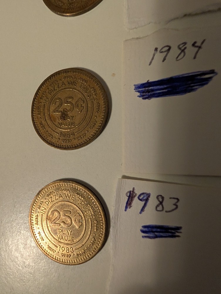 8. Old Chuck-E-Cheese Tokens And A Token Cup