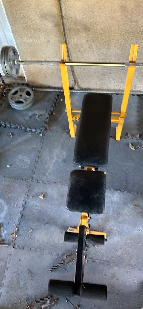 bench press with weights. Needs A Little Wipe Down But That Is About It.