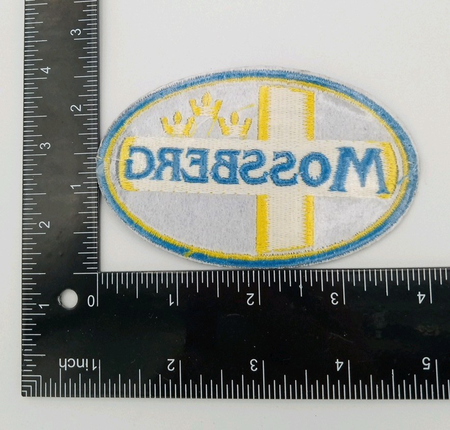 Mossberg Firearms Embroidered, Iron On Patch . Blue & Yellow
