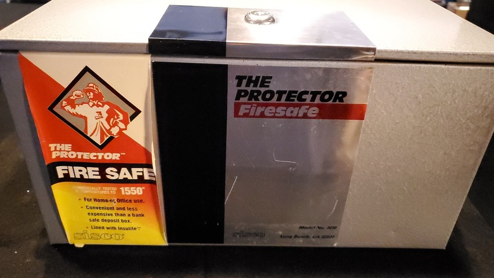 The Protector Fire Safe Grey and Silver New with Key