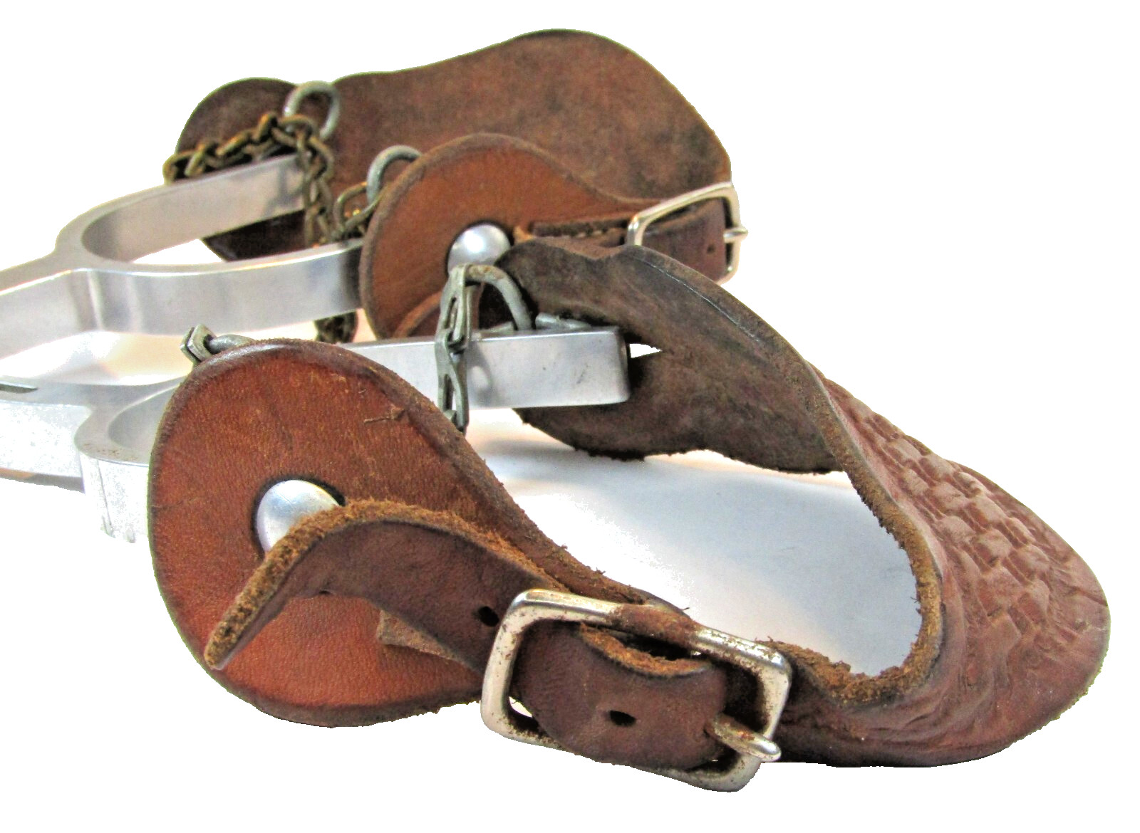 PAIR OF UNMARKED ENGRAVED ALUMINUM AIRPLANE METAL RIDING SPURS W/ STRAPS