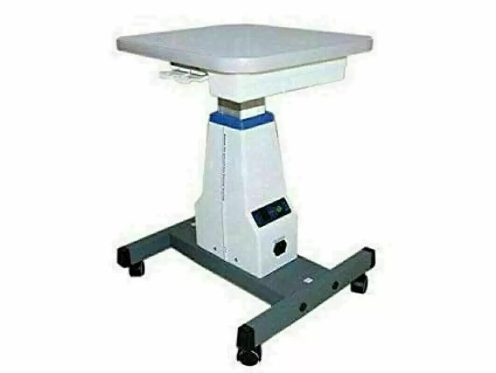 Universal motorized table for slit lamp