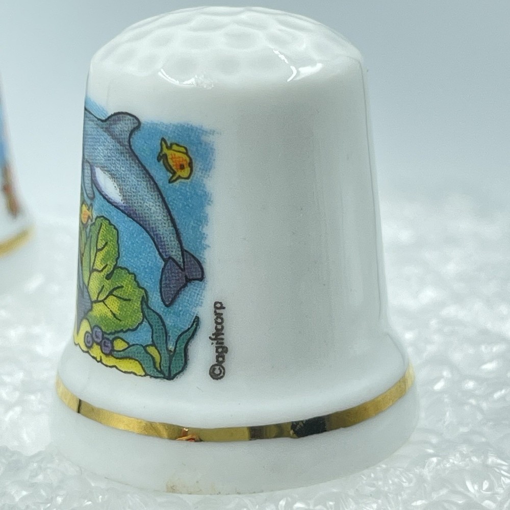 2 Porcelain Souvenier Thimbles - Roatan & St.Thomas