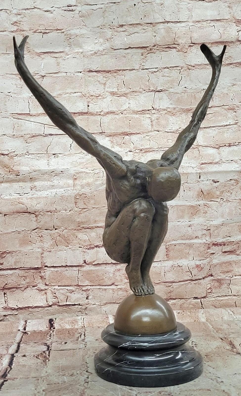 Abstract Bronze Male Figure Balancing on Sphere with Outstretched Arms Sculpture