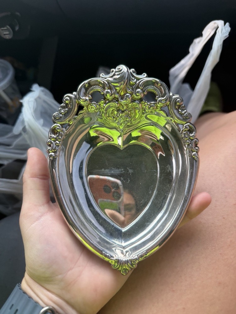 Ornate silver-plated heart-shaped bonbon dish with Baroque detailing.
