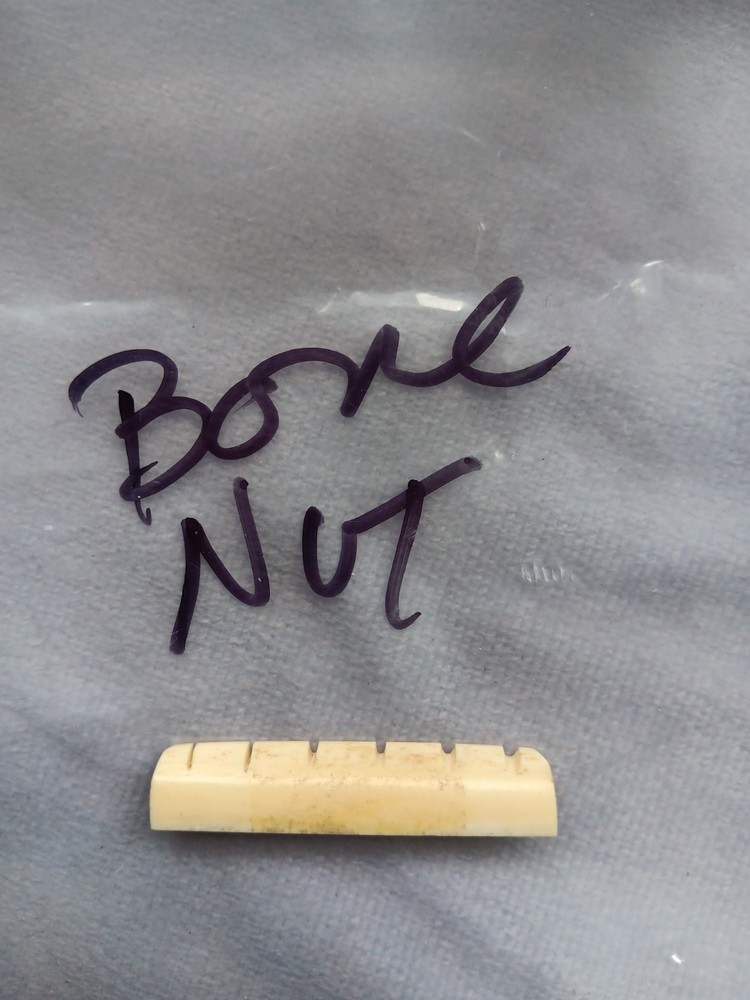 Vintage unbranded bone guitar nut, white