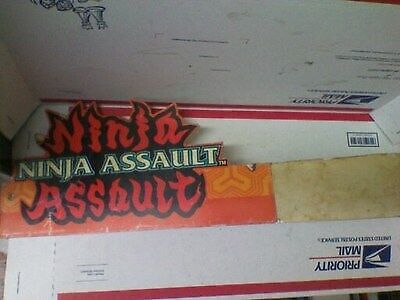 Ninja Assault arcade sign with mounting brackets