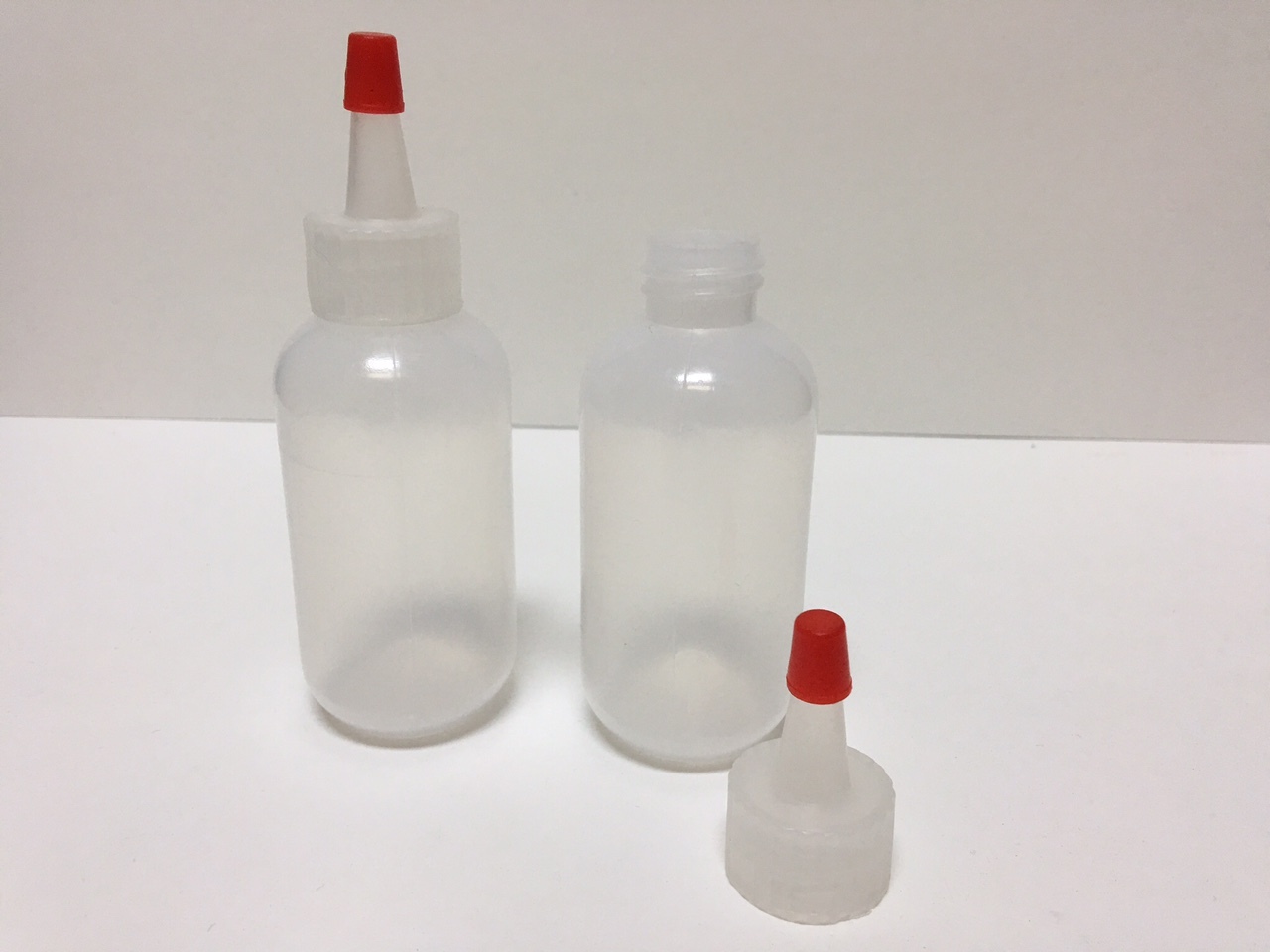 6 pack of 2oz (60mL) Plastic Boston Round Squeeze Bottles with Yorker Caps HDPE