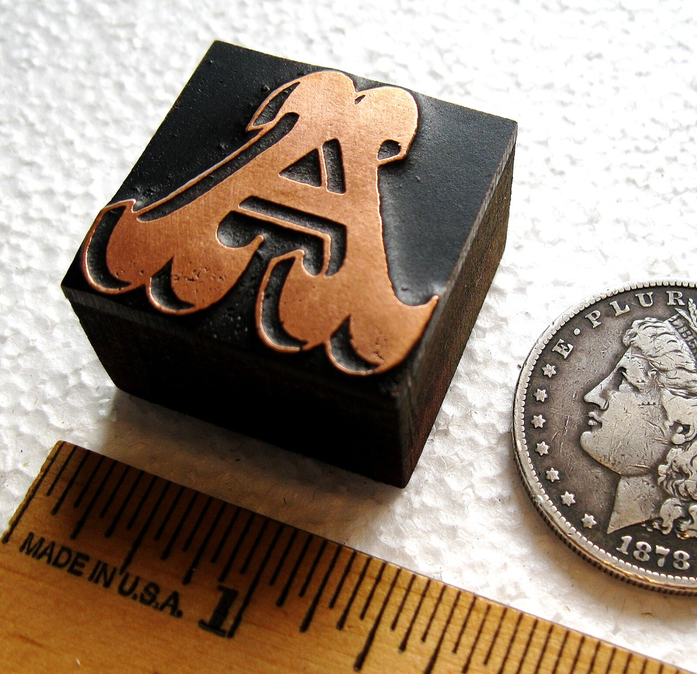 Copper faced ornate letter UC A