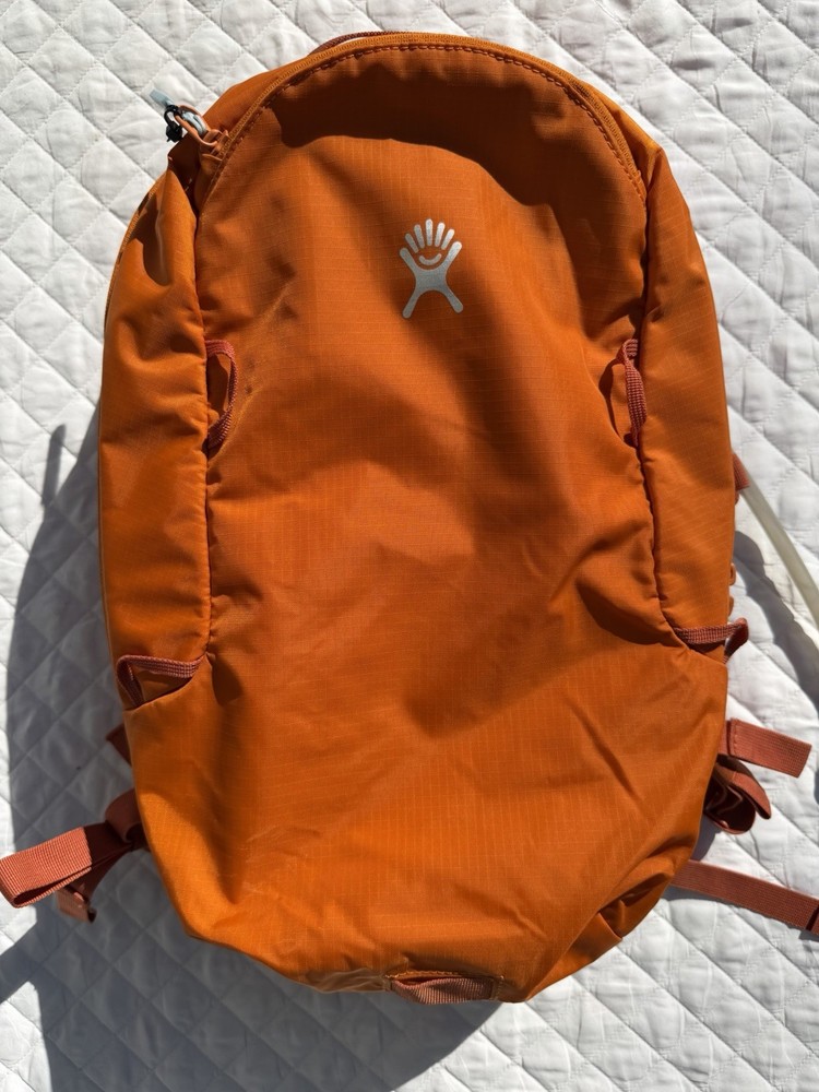 Hydro Flask Down Shift Hiking Backpack 14 Liter Hydration Day Pack Bronze Orange