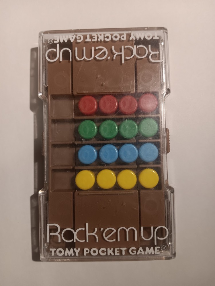 Rack 'Em Up Handheld Puzzle Game Tomy Pocket Game