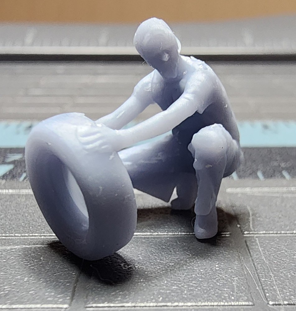 1/64 3D Printed Guy Kneeling with Tire
