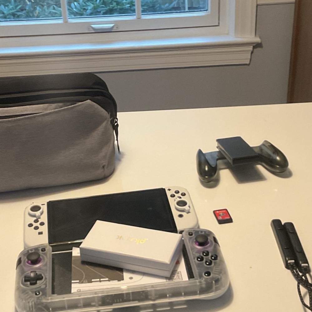 Nintendo Switch & CRKD Nitro Deck Bundle w/ Super Mario Odyssey, Accessories