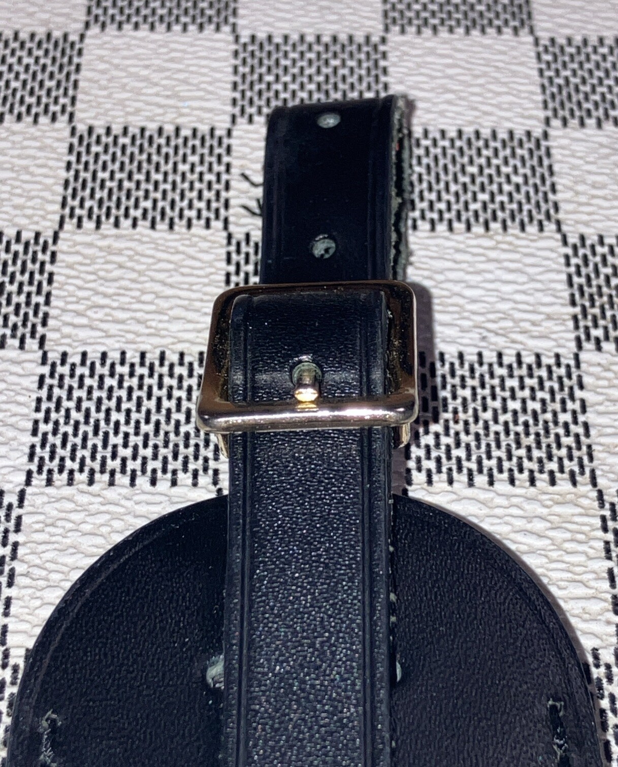 Authentic Louis Vuitton small Black W/ Gold Hardware name tag.