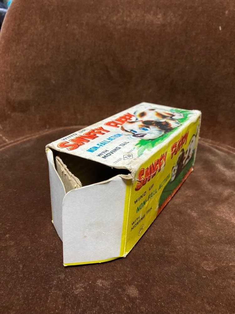 Tin wind-up toy dog