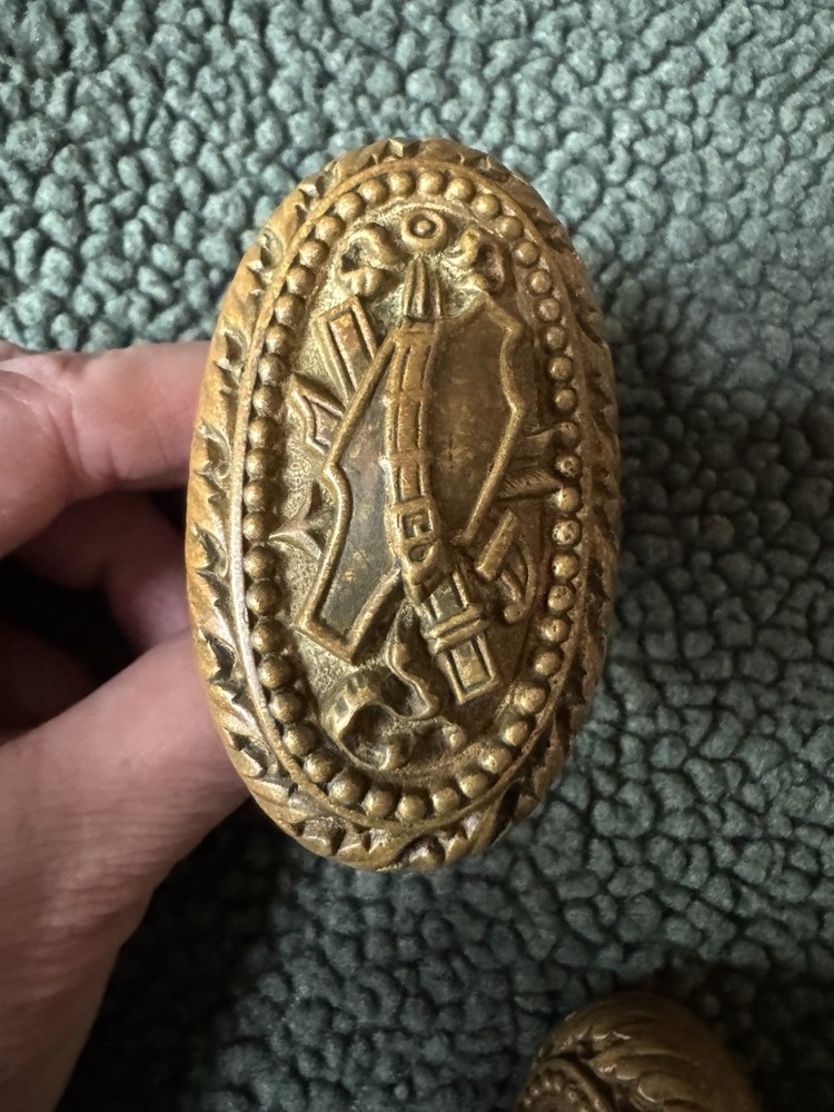 Antique Victorian Brass Oval Door Knobs Shield & Belt Garter Design