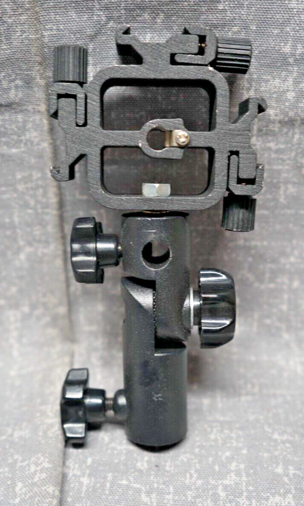 Promaster Triple Shoe Flash Mount Adapter with adjustable light pole mount.