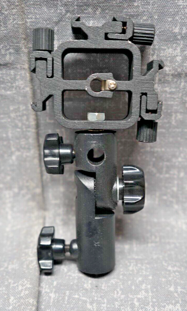 Promaster Triple Shoe Flash Mount Adapter with adjustable light pole mount.