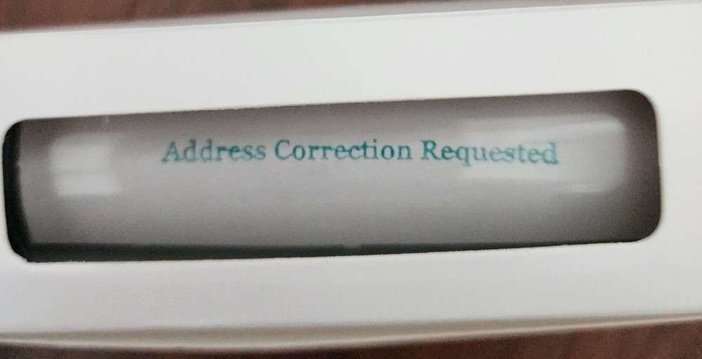 Self inking stamp "Address Correction Requested" in green #10 font