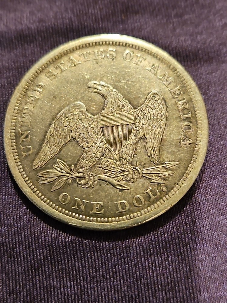 1841 seated liberty dollar coin.