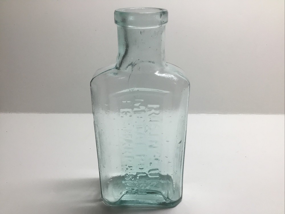 Small Antique Aqua Risin’ Sun Metal Polish Bottle. J. E. Sharp & Son.