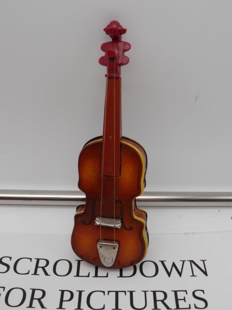 ANTIQUE  PRESS STEEL MINIATURE STRING INSTRUMENT