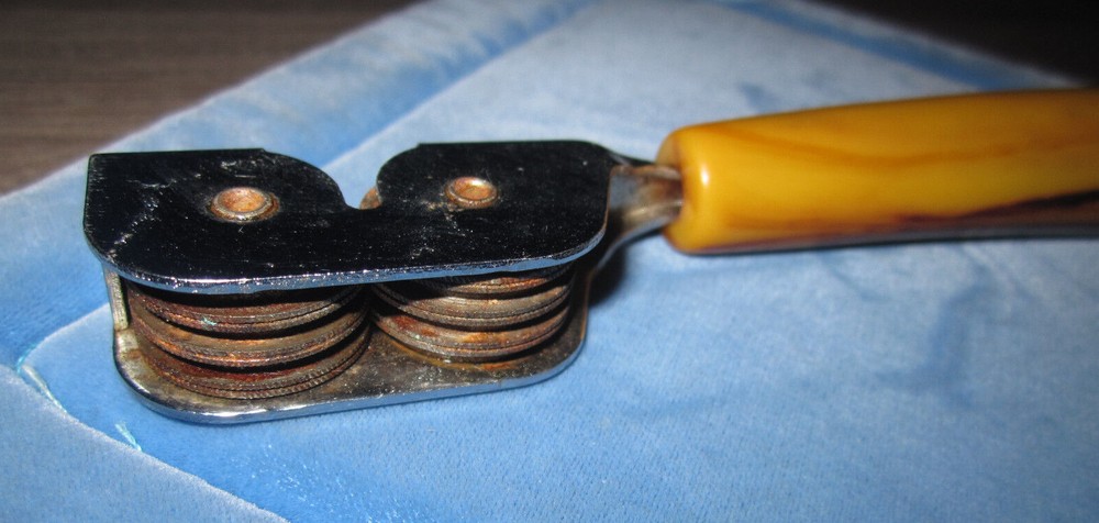 Vintage butterscotch Bakelite handle pull through knife sharpener