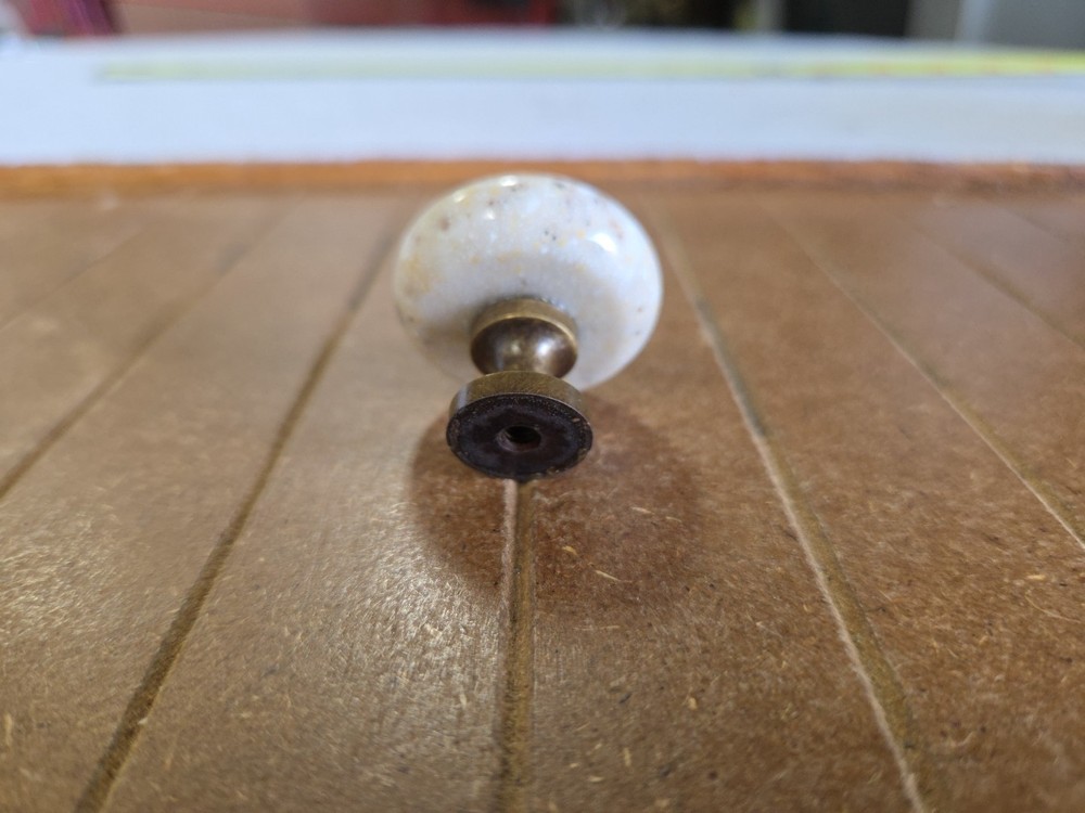 1.25 inch beige stone round cabinet knobs antique brass base