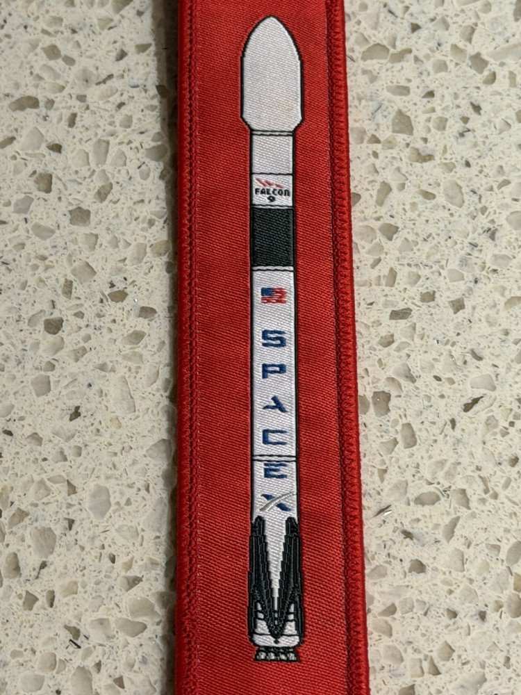 Pre-Owned Red SpaceX Falcon 9 Rocket Remove Before Flight Keychain Zipper Pull