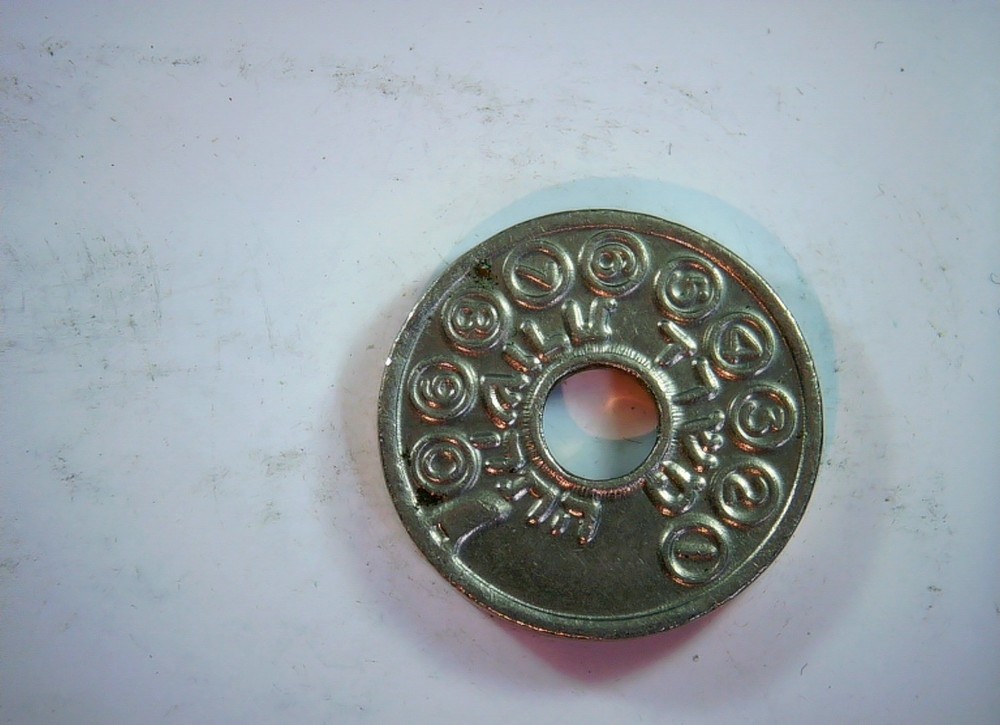 Telephone token (Arabic script; central hole) Token