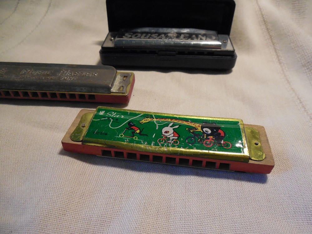 Three harmonicas Sousa band, star, music master