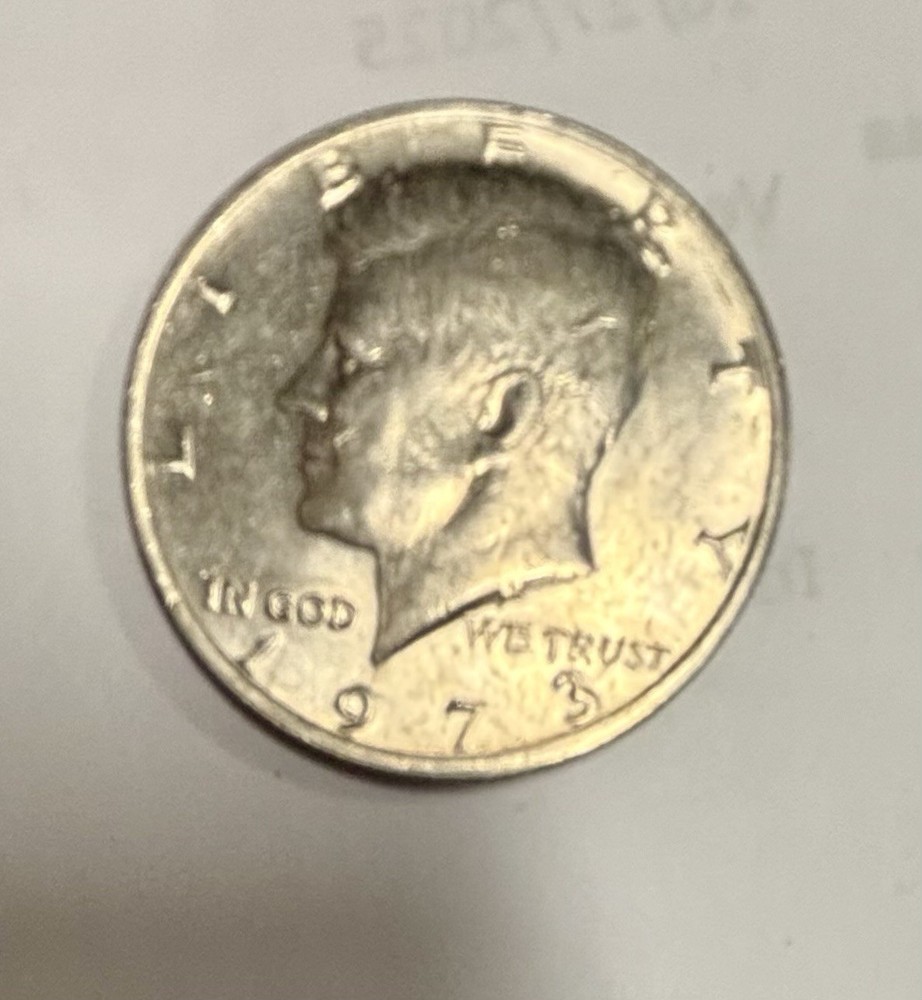 1973 Kennedy Half Dollar With No Mint Mark, Error On E
