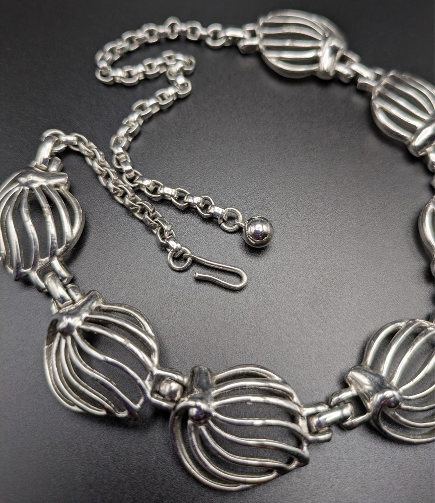 Silver-Toned Bracelet and Necklace Set Featuring Abstract Leaf Patterns