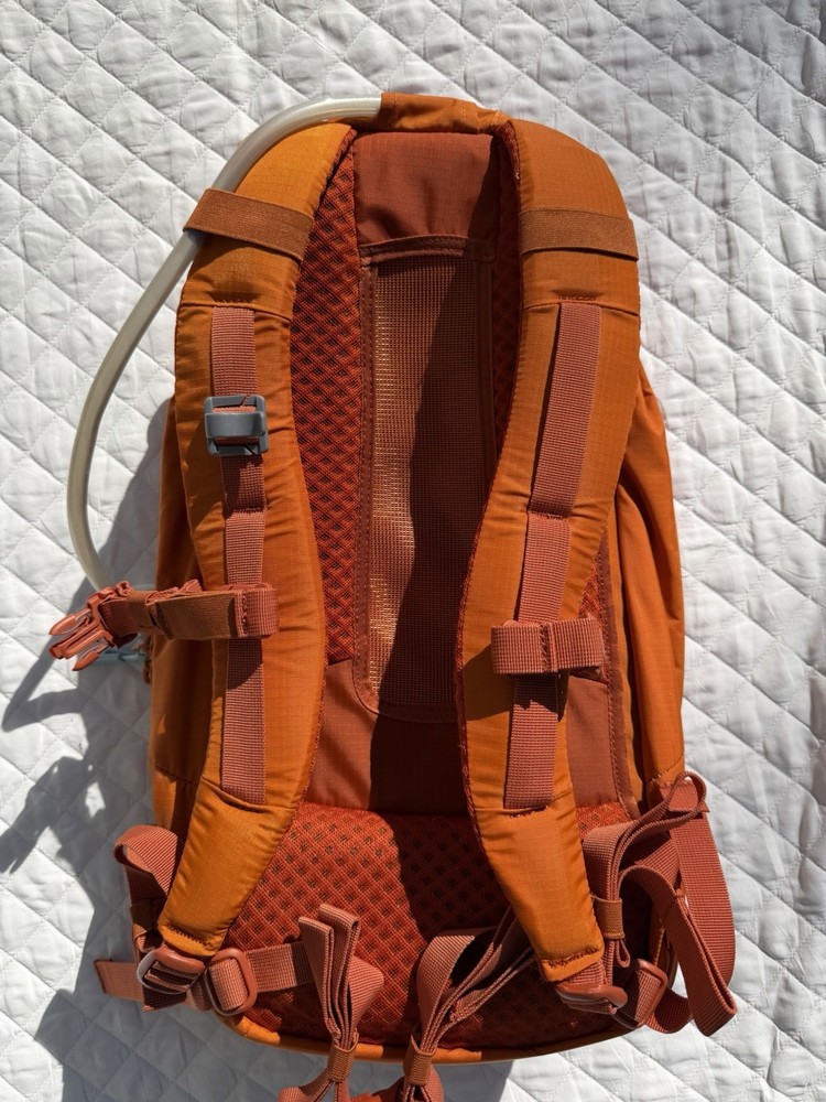 Hydro Flask Down Shift Hiking Backpack 14 Liter Hydration Day Pack Bronze Orange