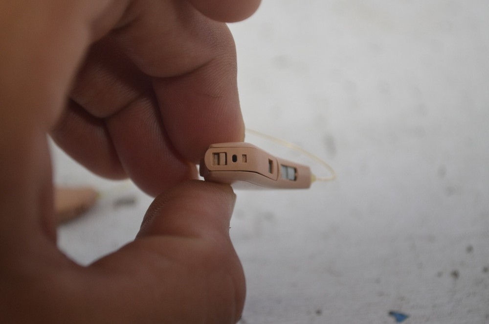 Resound Hearing Aids as is not tested missing button , might affect function