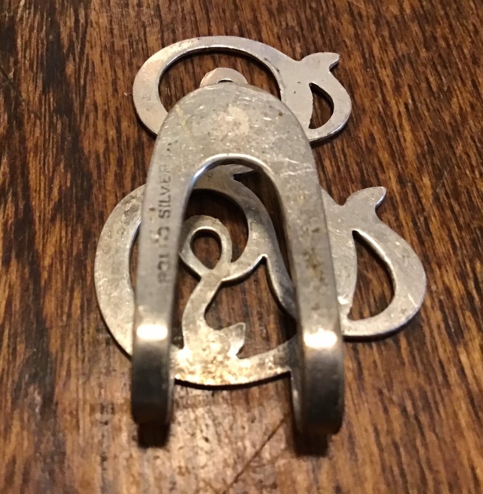 Vintage sterling Apollo initial napkin holder “E”