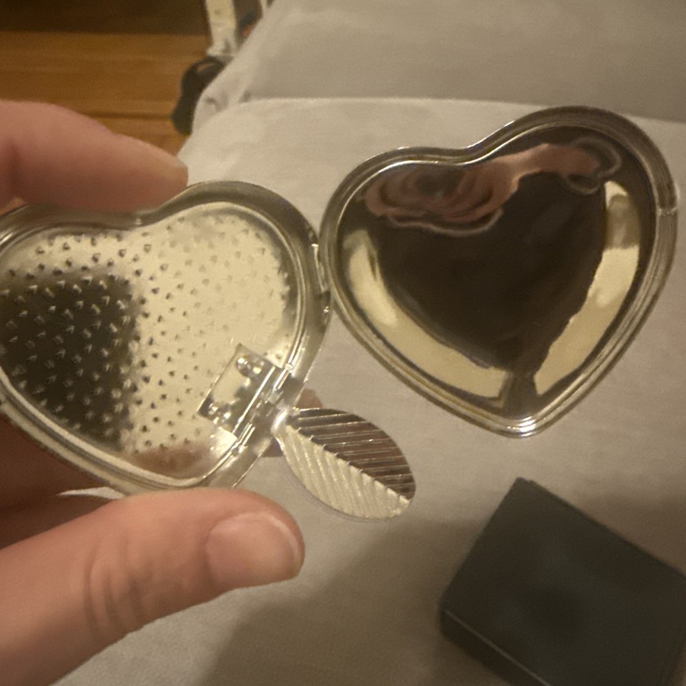 silver color pill box heart shape with leaf