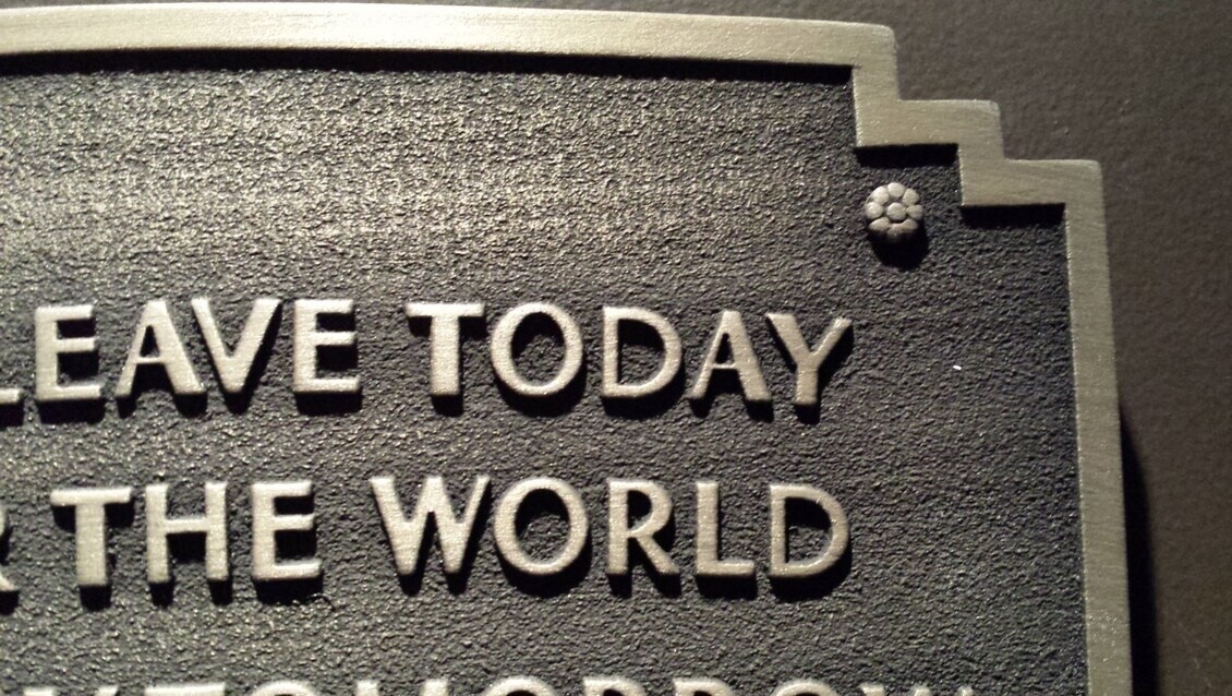 Disneyland entranceway sign plaque