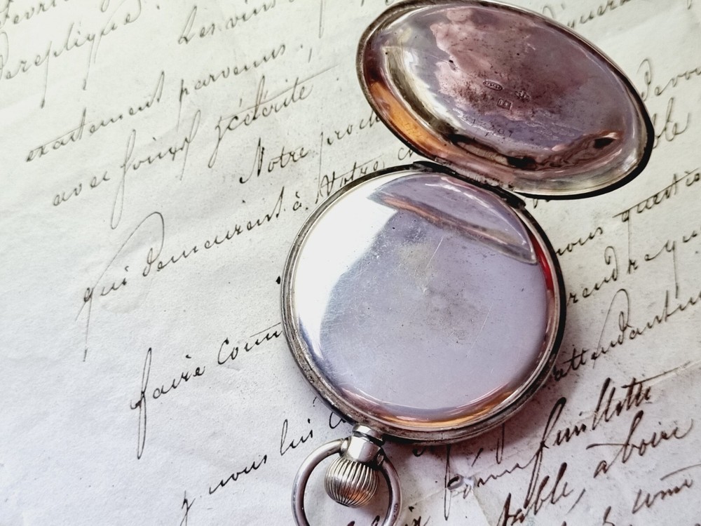 silver open face pocket watch