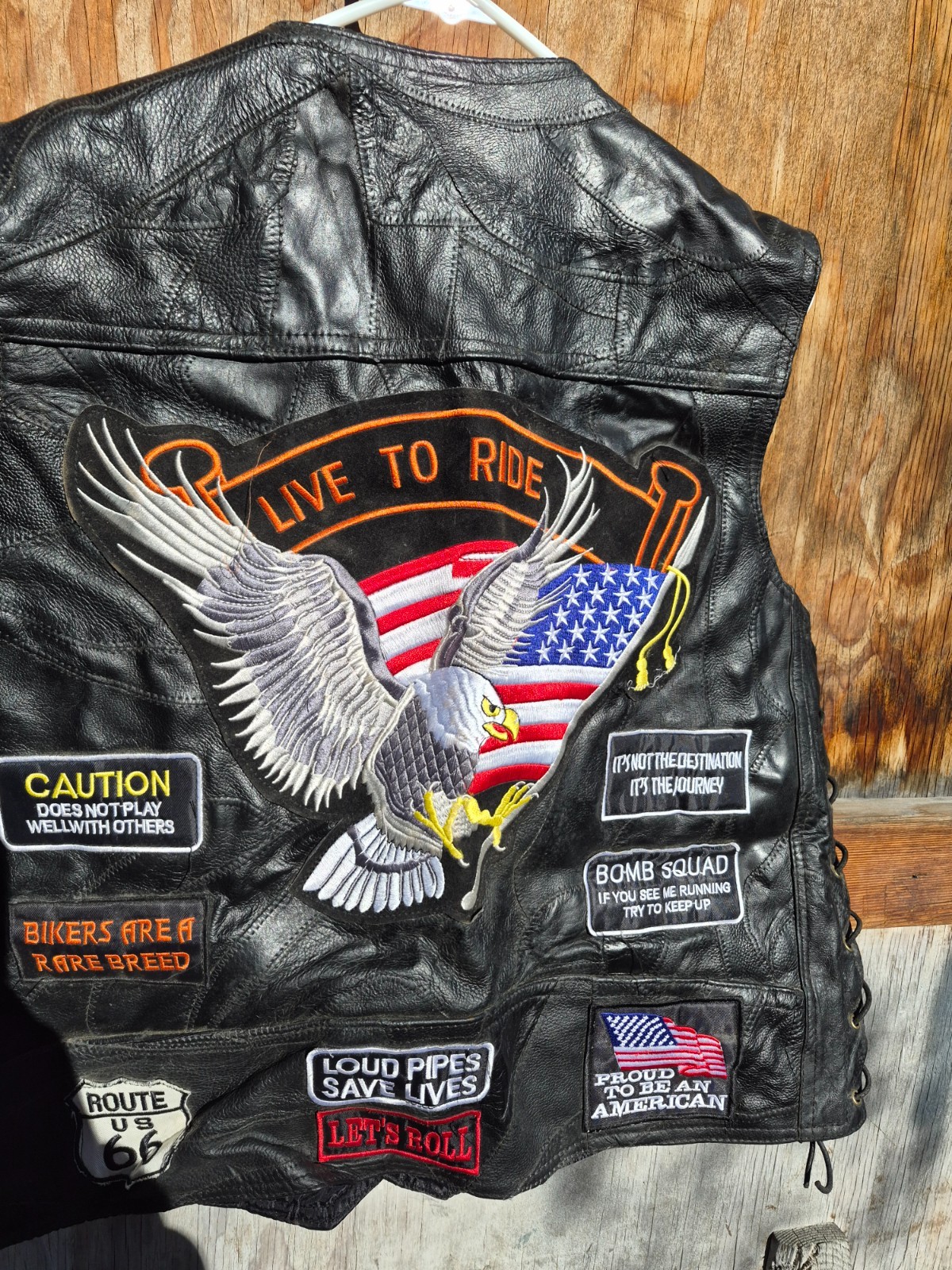 Vintage harley hog leather vest filled with pins and has patches 2xl