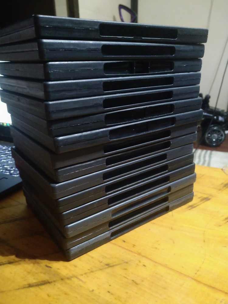 15 Empty DVD Cases - plastic covers are still intact.