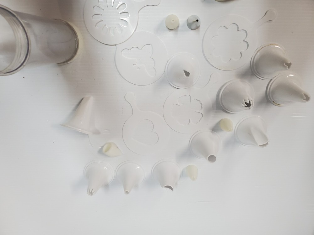 White plastic Cookie Press Disc Cutouts -with extras