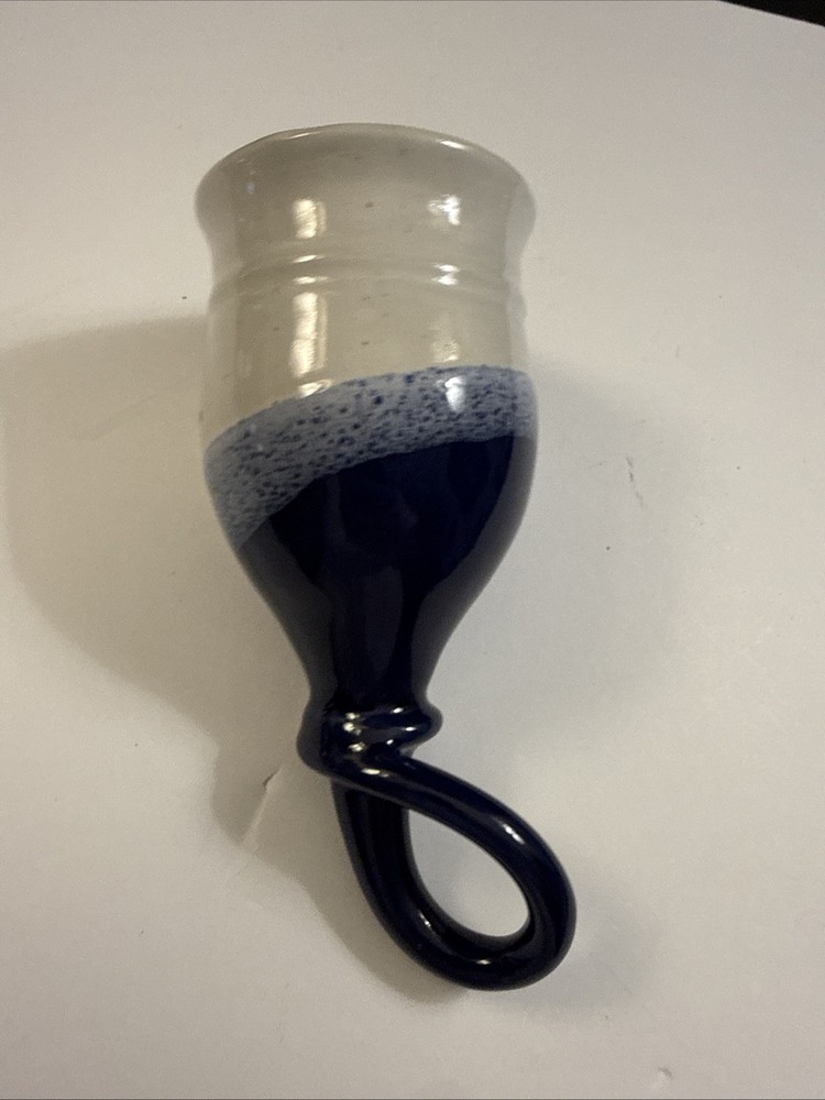 Handmade studio pottery drinking horn with a looped handle.