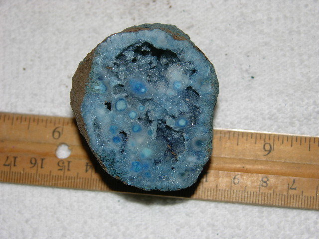 Geode cut & polished half with colored crystal center 2 inch E52