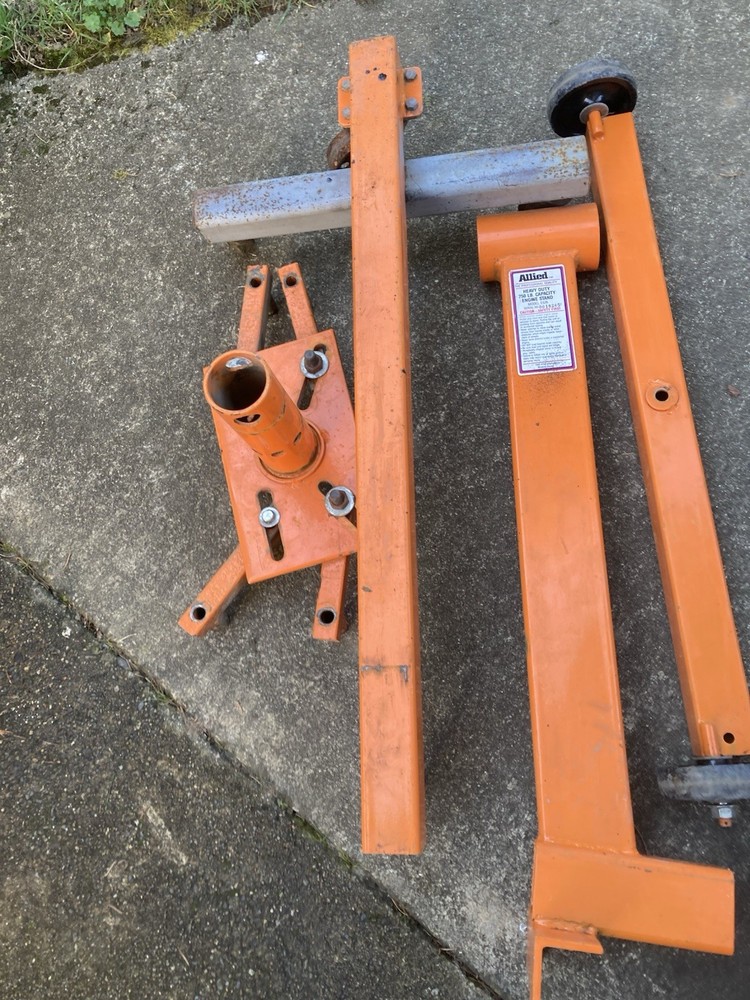 Engine Rebuild Stand Modified for Greater Stability with additional Wheels.