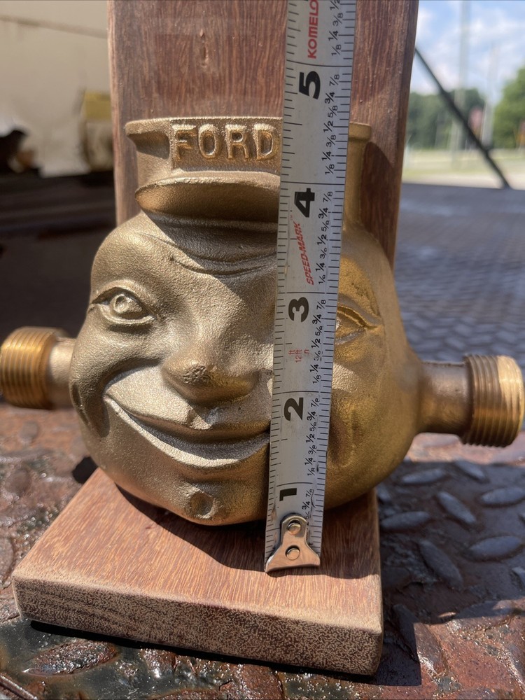 Brass award trophy mans face FORD hat